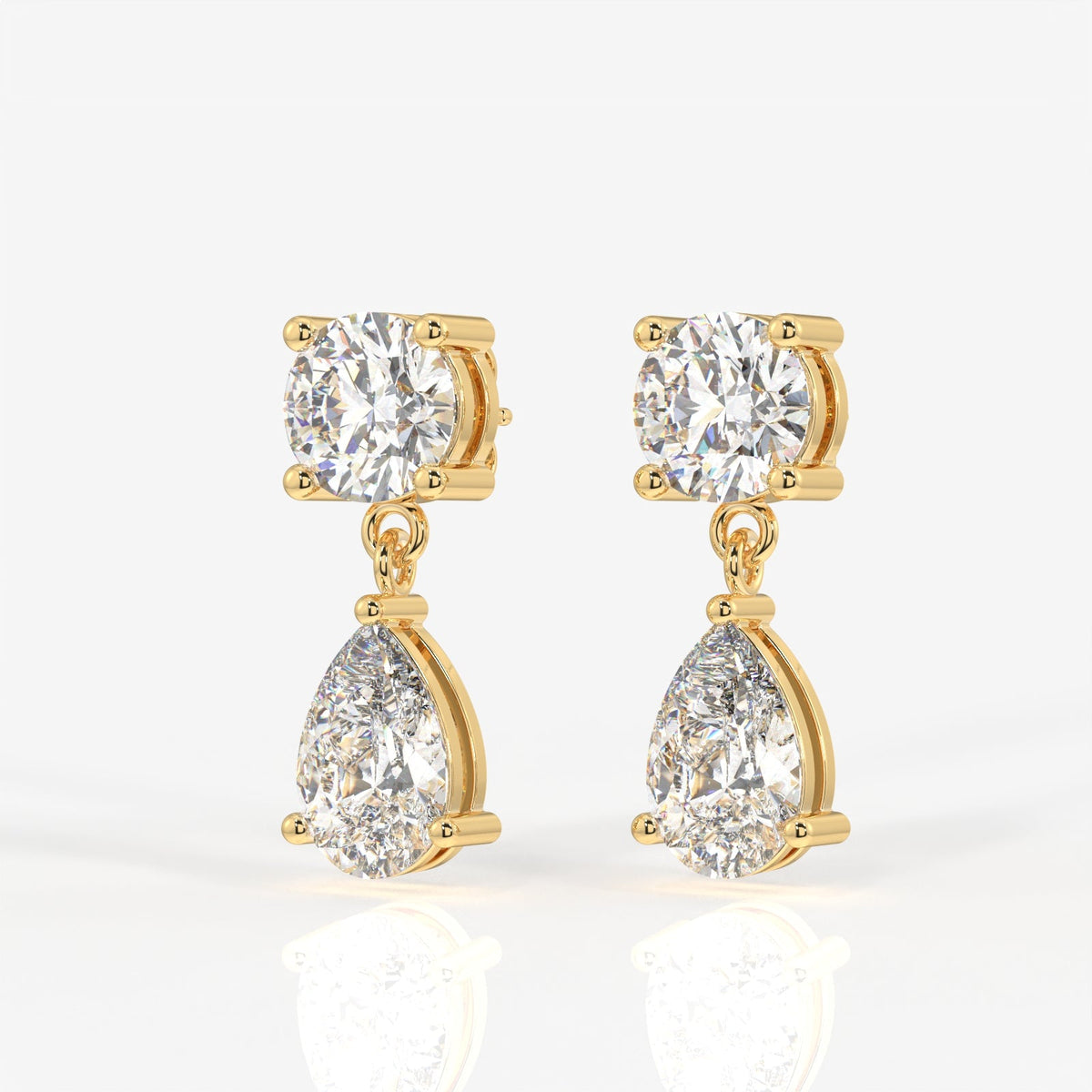 Round and Pear Cut Moissanite Diamond Dangle Sterling Silver Earrings